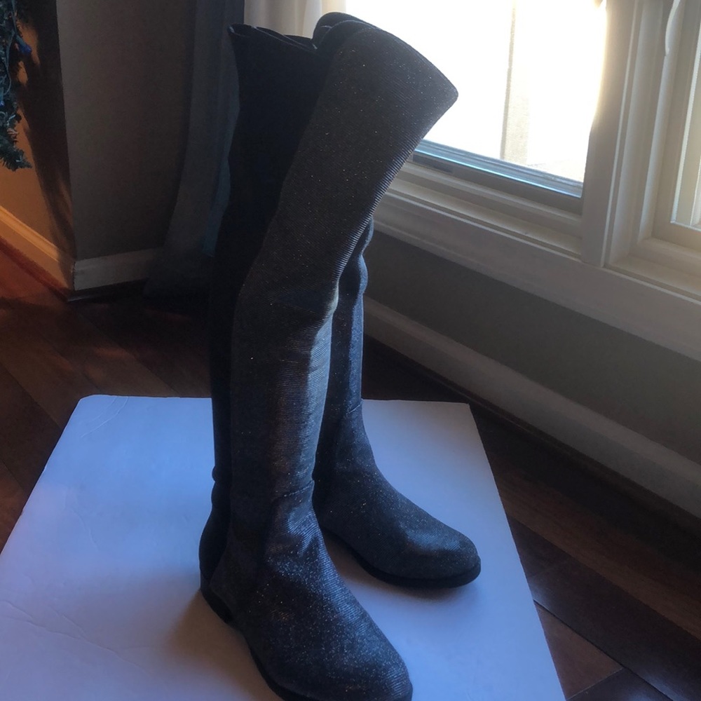 Never worn glitter over the kneeboots with stretch in the back. Unisa size 7.5 M